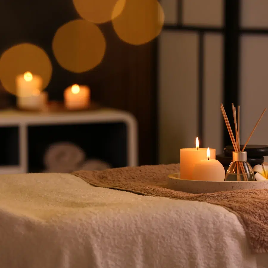 Ambiance spa avec bougies et diffuseur